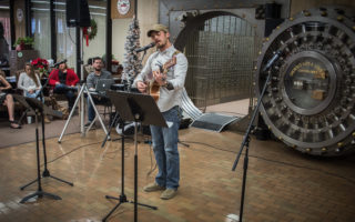 Local singers add sounds of Christmas to First National Bank party