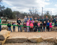 Ribbon cutting in city park makes dinosaur official