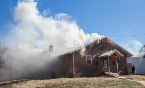House fire and grass fire keep local firefighters busy