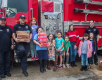 Local Girl Scouts donate smoke detectors to fire department