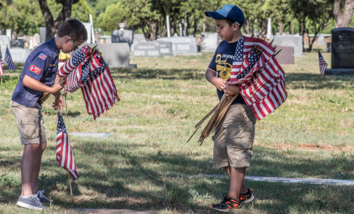 Honoring the fallen: Local Cub Scouts place flags on veterans’ graves