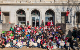 Second Graders Visit Courthouse for Christmas Caroling, Santa Photos and Stories