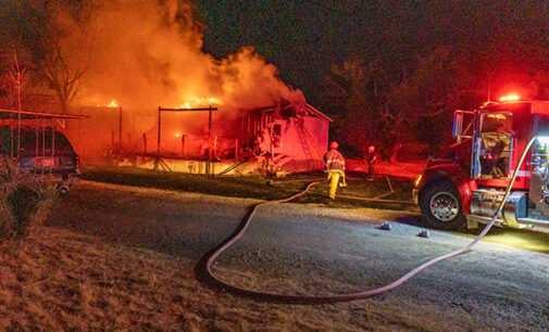 Breckenridge firefighters battle house fire on East Lindsey