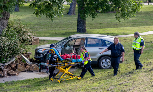 One person injured in wreck that landed vehicle in City Park