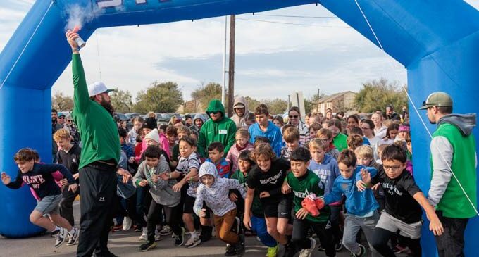 South Elementary students hit the streets for annual Turkey Trot race, after weather delay